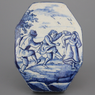 A Dutch Delft brush back with a dancing scene, 18th C.
