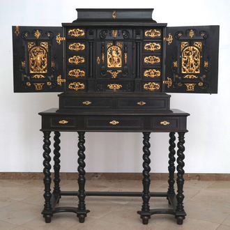 A South-German ebony veneer and gilded copper cabinet, 17th C.