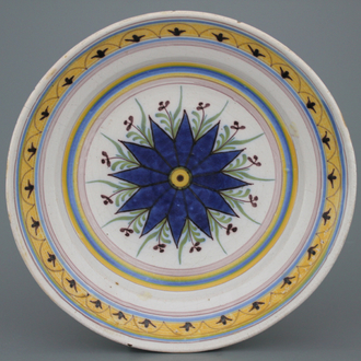 A fine Brussels faience dish with a central star, late 18th C.
