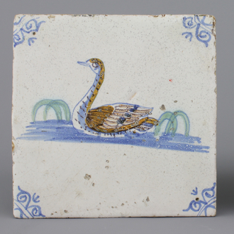 A Dutch Delft polychrome tile with a swan, 17th C.