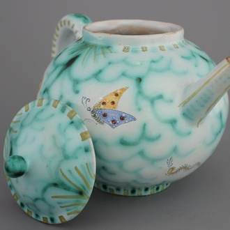 A rare Brussels faience teapot and cover with butterflies, 18th C.