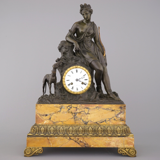 A large French Empire gilt and patinated bronze pendule, early 19th C.