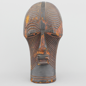 A carved wood African Songye mask, early to mid 20th C.