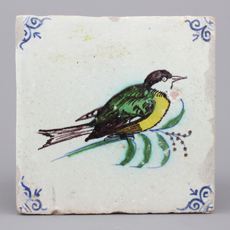 A polychrome Dutch Delft tile with a bird, 17th C.
