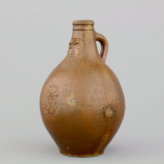 A German stoneware bellarmine jug, 17th C.