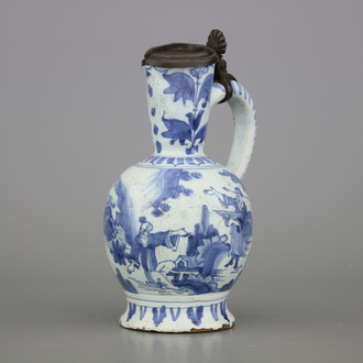 A Dutch Delft blue and white chinoiserie jug with pewter lid, late 17th C.