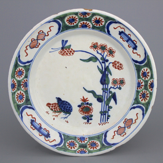 A Dutch Delft polychrome kakiemon style quail plate, early 18th C.
