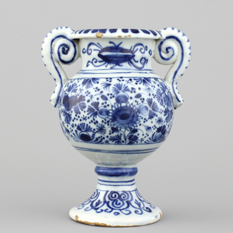 A Dutch Delft blue and white altar vase, early 18th C.