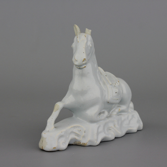 A white Delft model of a recumbent horse, 18th C.