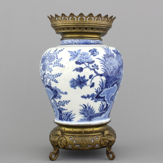 A Dutch Delft blue and white brass-mounted vase, late 17th C.