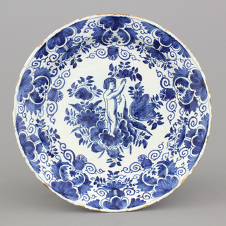 A Dutch Delft blue and white plate with a putto, 18th C.
