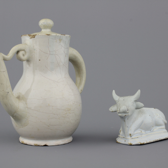 A white Delft model of a recumbent cow and a lidded jug, both 18th C.