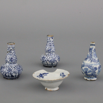 A group of Dutch Delft blue and white miniature vases and a shaving bowl, 18th C.