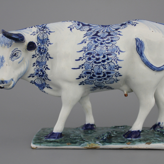 A Dutch Delft model of a cow, 18th C.