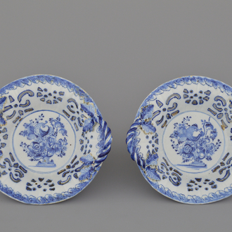 A pair of Dutch Delft blue and white open-worked baskets, 18th C.