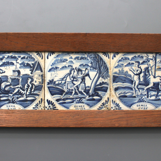 A framed set of 3 Dutch Delft blue and white biblical tiles, 18th C.