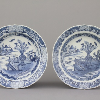 A pair of Chinese porcelain blue and white plates with landscape decoration, 18th C.