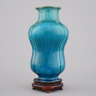 An unusual Chinese turquoise monochrome vase on carved wood stand, 18th C.