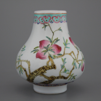 A Chinese porcelain famille rose small nine peaches vase, 19th C.