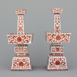 A pair of Chinese porcelain coral red decorated altar candlesticks, 19th C.