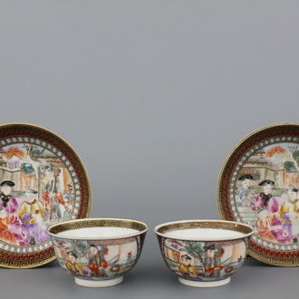 A pair of Chinese porcelain famille rose mandarin cups and saucers, Qianlong, 18th C.