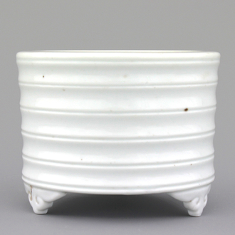 A blanc de Chine cylindrical censer on four feet, 19th C.