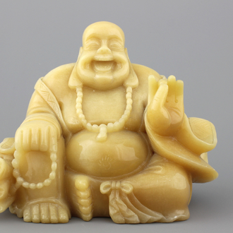 A Chinese carved hardstone figure of buddha, 20th C.