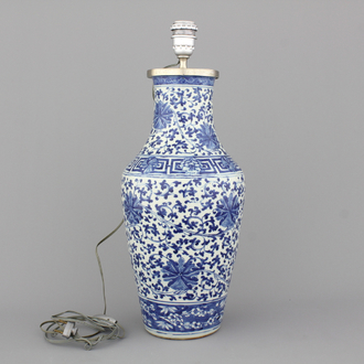 A Chinese porcelain blue and white vase with lotus scrolls, mounted as lamp, 19th C.