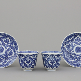 A pair of Chinese porcelain blue and white cups and saucers, Guangxu