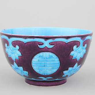 A Chinese porcelain fahua relief-decorated bowl, 19th C.