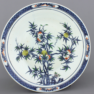 A very large Chinese doucai dish with "nine peaches" decoration, 19th C.