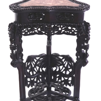 A Chinese carved wood and marble triangular vase stand