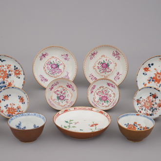 A collection of various cups and saucers in Imari and famille rose palette, 18th C.