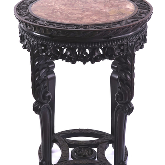 A Chinese carved wood and marble round vase stand