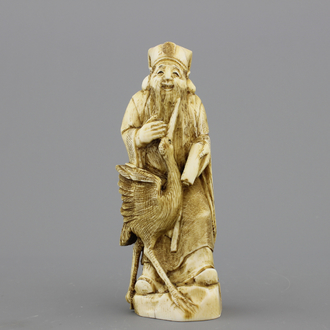 Figure japonaise sculptée "okimono" d'un Sage avec une grue, 19e