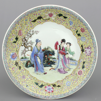 A fine large Chinese porcelain charger with figures in a garden, 20th C.