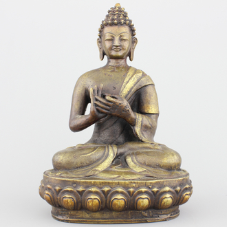 A Sino-Tibetan partly gilt bronze buddha, 19/20th C.