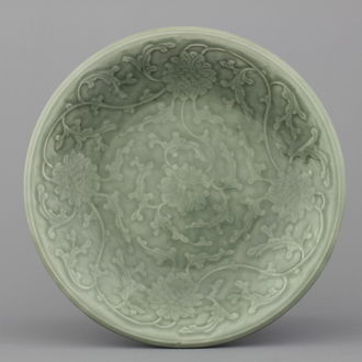 A Chinese porcelain celadon lotus scroll dish, 19th C.