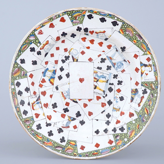 A large French faience dish with playing cards, Lille, 18th C.