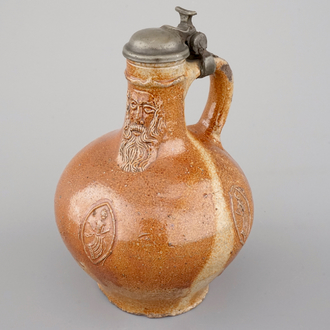 A fine beardman's or bellarmine jug with pewter cover, Raeren, late 16th C.