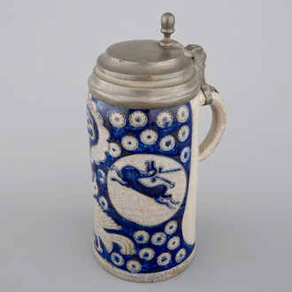 A tall Westerwald incised and pewter-mounted beer stein with deers and birds, 17th C.