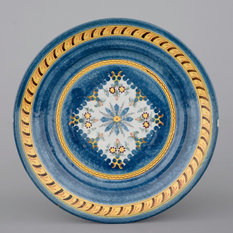 A Brussels faience blue-ground plate with floral decoration, 18th C.