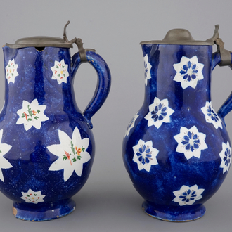 Two Brussels faience blue ground pewter-mounted jugs, 18th C.