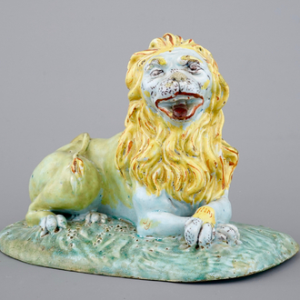 An important Brussels faience figure of a lion, 18th C.