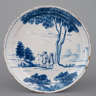A fine English Delftware blue and white landscape plate, 18th C.