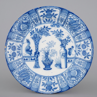 A fine Dutch Delft blue and white chinoiserie dish with "antiquities", late 17th C.