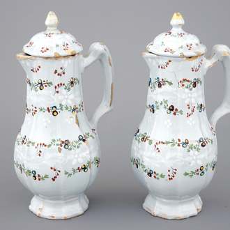 A fine pair of polychrome French faience jugs and cover, 18th C.