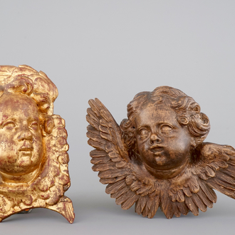 Two sculpted wooden heads of putti, 18/19th C.