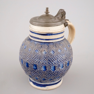 A globular Westerwald stoneware jug with applied decoration, 17th C.