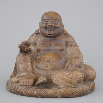 A partial gilt seated bronze buddha, Yongzheng mark, 19th C. or earlier